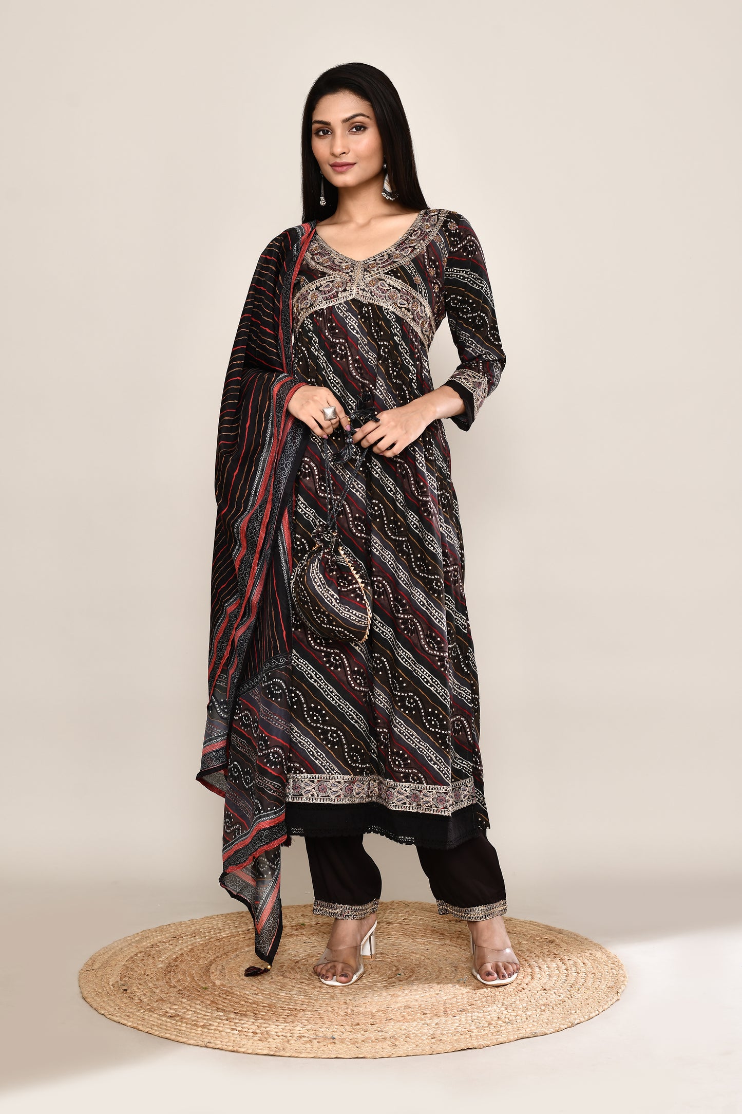 Festive Bandhani Leheriya Mix Printed Black 4Pcs Suit Set With Embroidery And Potli