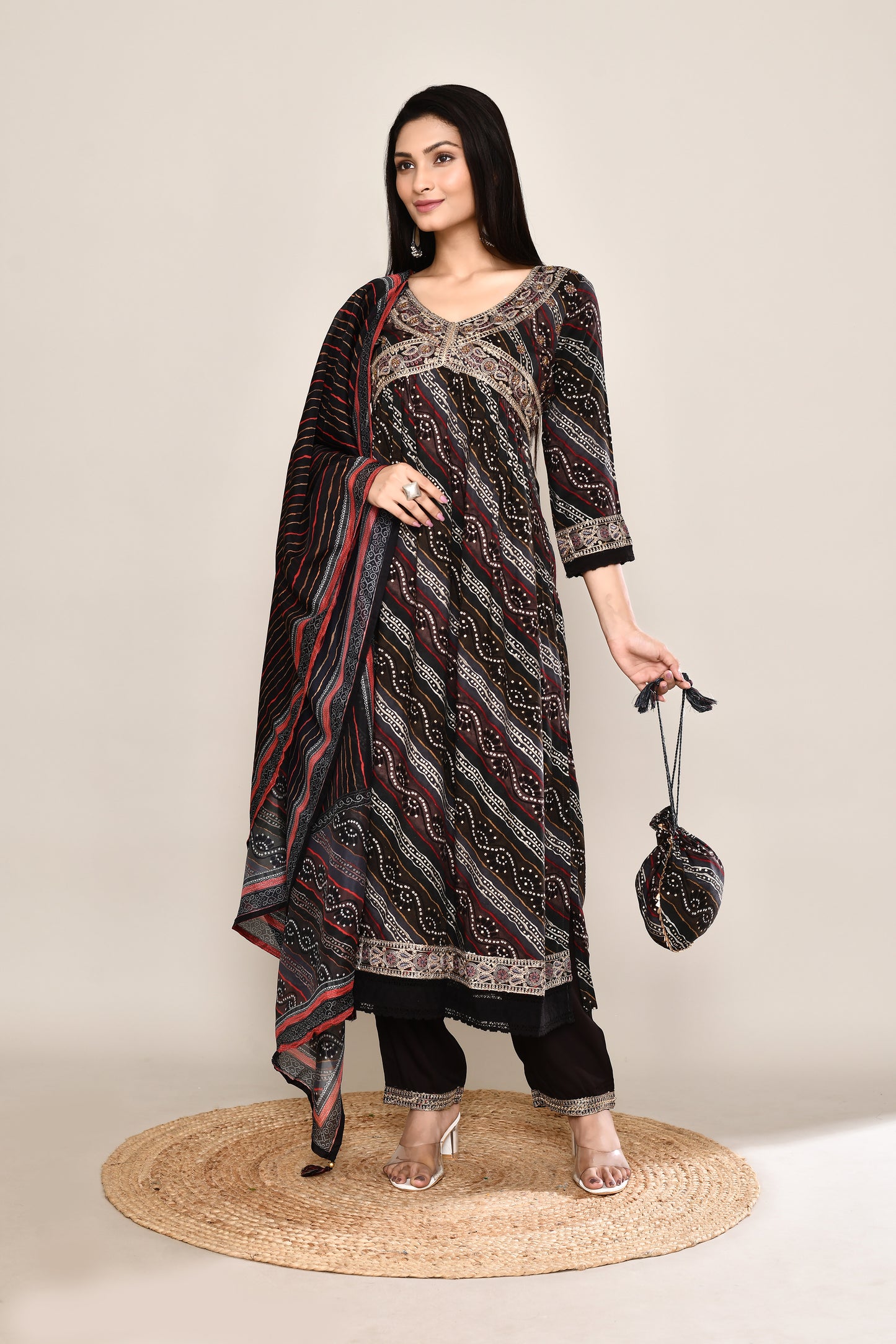 Festive Bandhani Leheriya Mix Printed Black 4Pcs Suit Set With Embroidery And Potli